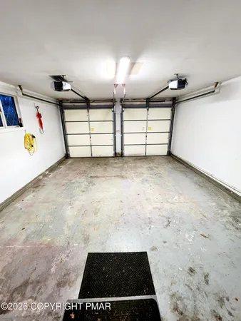 a view of a hallway with wooden shelves