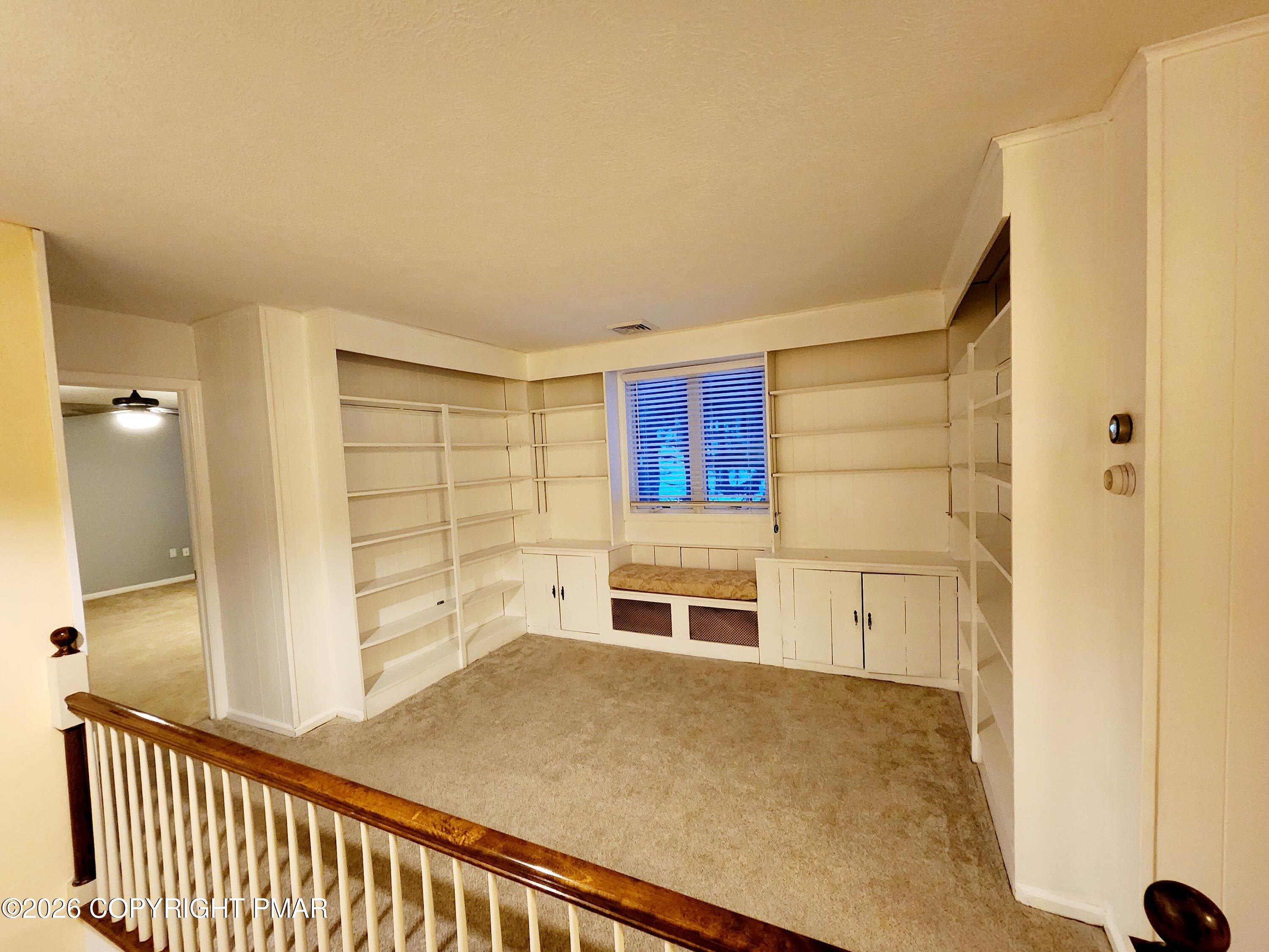 239 Rock Ridge Road Mount Pocono, PA 18344 - Photo 17 of 33 a view of a hallway with wooden shelves