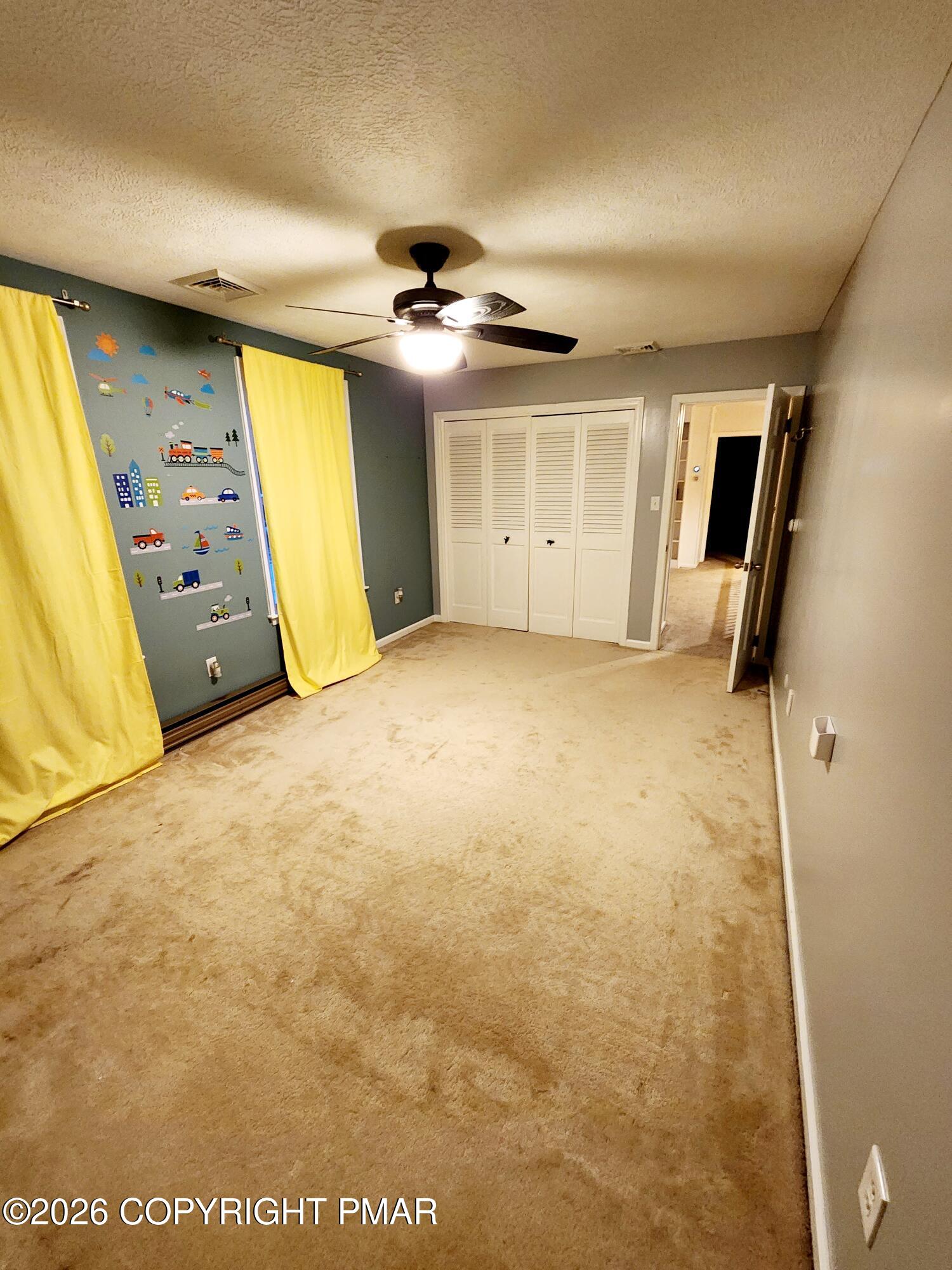 239 Rock Ridge Road Mount Pocono, PA 18344 - Photo 21 of 33 a view of an empty room with a window