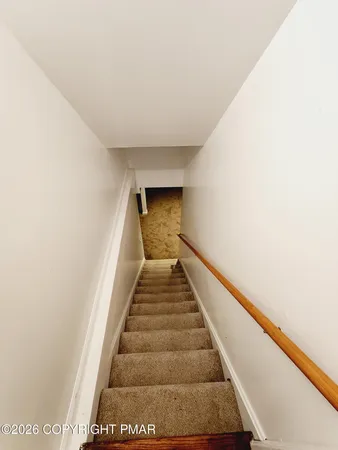 an empty room with a bathroom