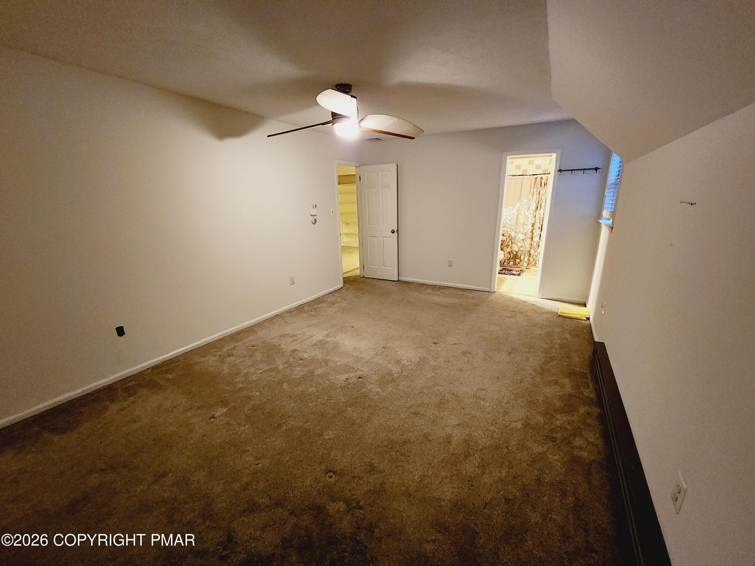 239 Rock Ridge Road Mount Pocono, PA 18344 - Photo 33 of 33 an empty room with a bathroom