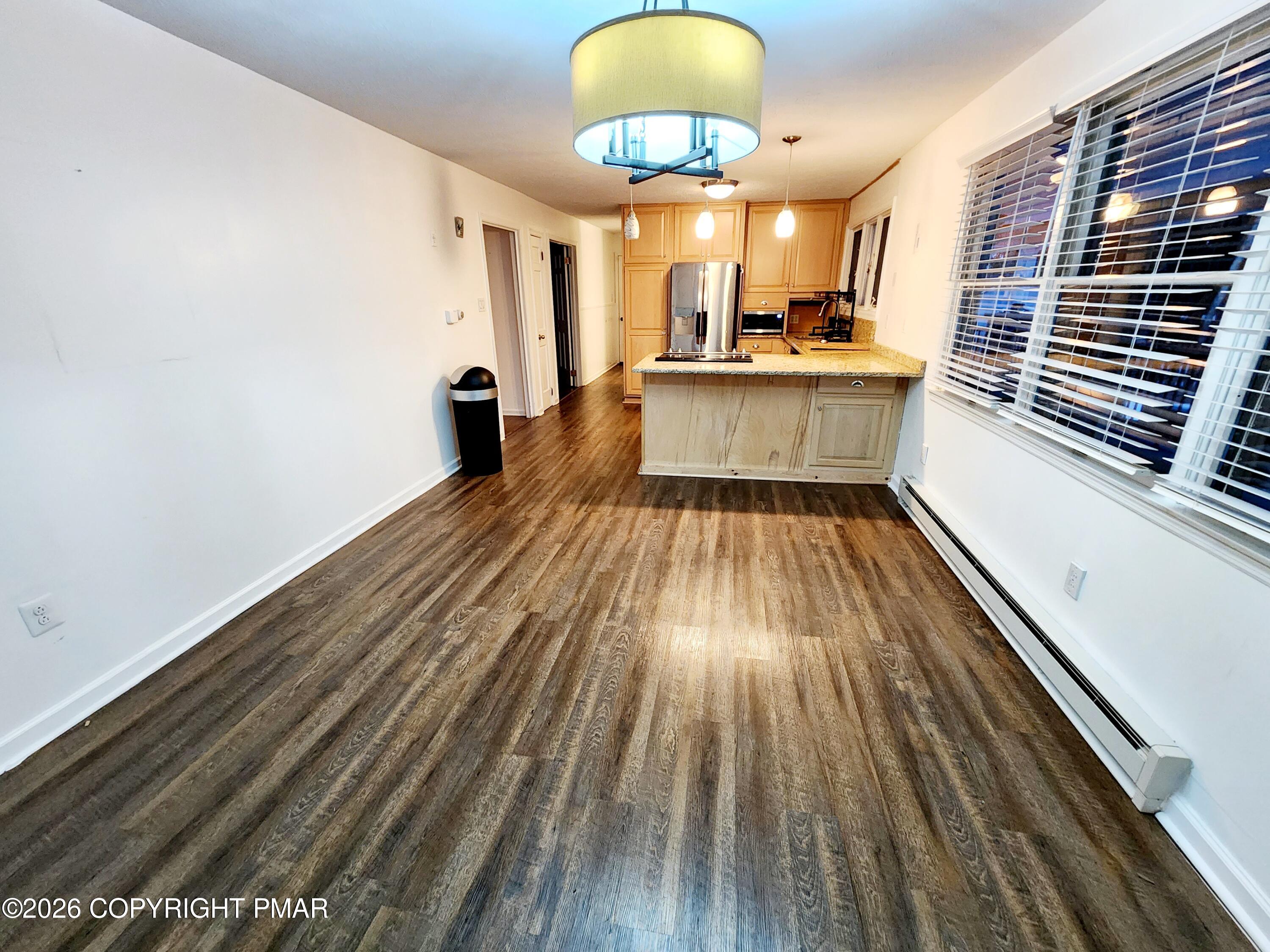 239 Rock Ridge Road Mount Pocono, PA 18344 - Photo 4 of 33 a view of a living room with wooden floor