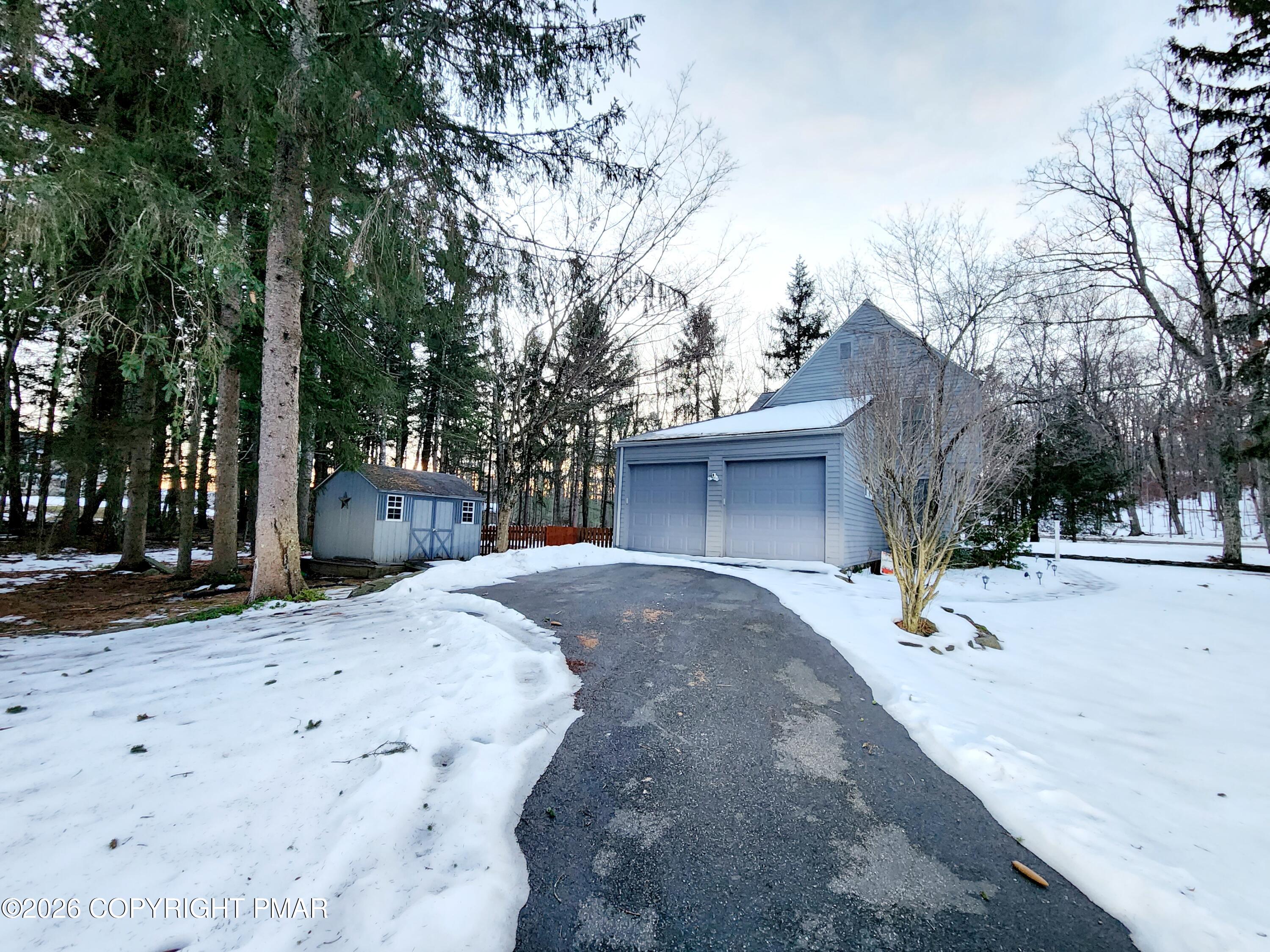 239 Rock Ridge Road Mount Pocono, PA 18344 - Photo 6 of 33 a view of a house with a snow in the road
