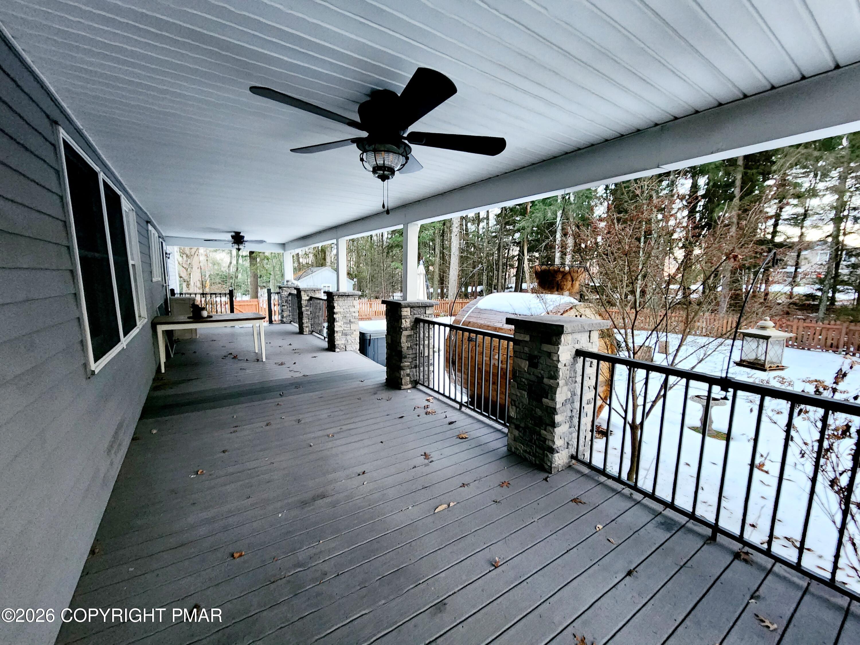 239 Rock Ridge Road Mount Pocono, PA 18344 - Photo 8 of 33 a view of a porch with wooden floor and outdoor space