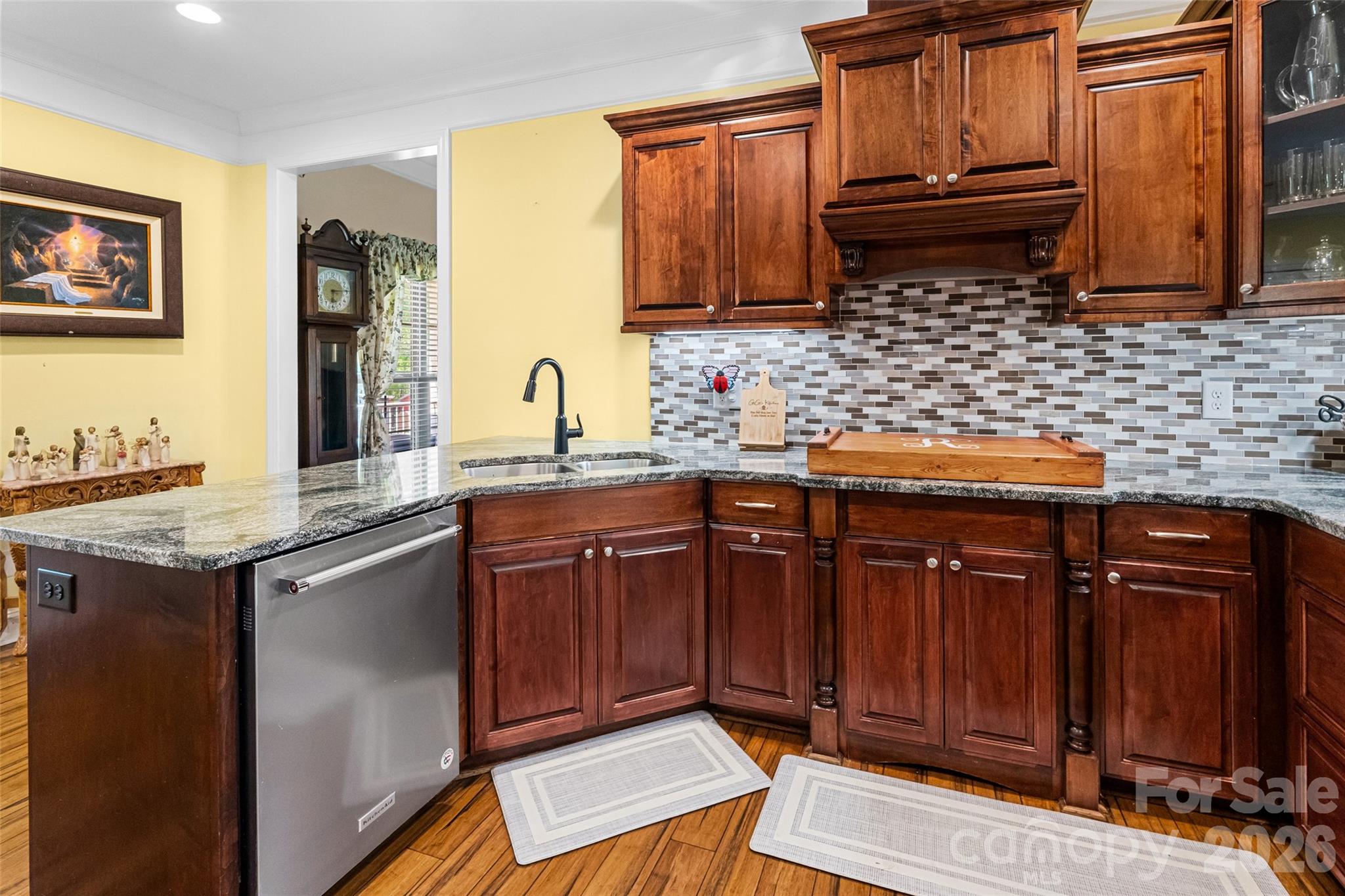 643 John Doster Road Pageland, SC 29728 - Photo 14 of 35 a kitchen with stainless steel appliances granite countertop wooden cabinets a sink and dishwasher