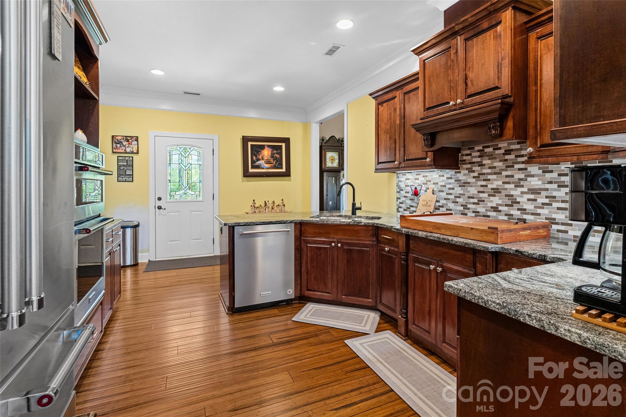 643 John Doster Road Pageland, SC 29728 - Photo 16 of 35 a kitchen with stainless steel appliances granite countertop a sink stove and cabinets