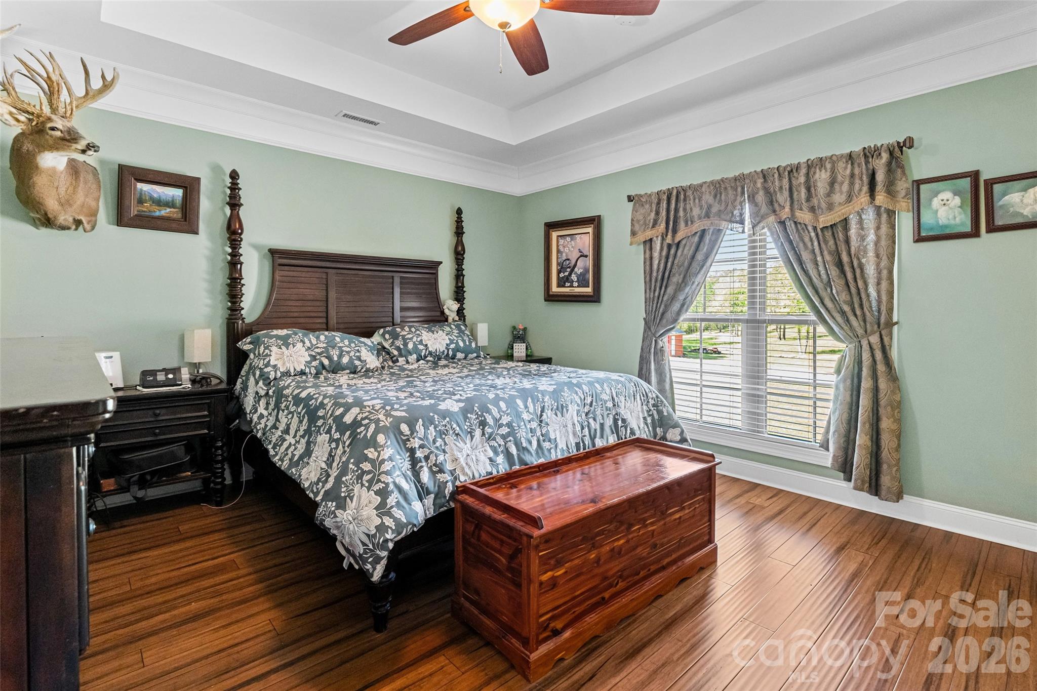 643 John Doster Road Pageland, SC 29728 - Photo 18 of 35 a bedroom with a bed wooden floor and window