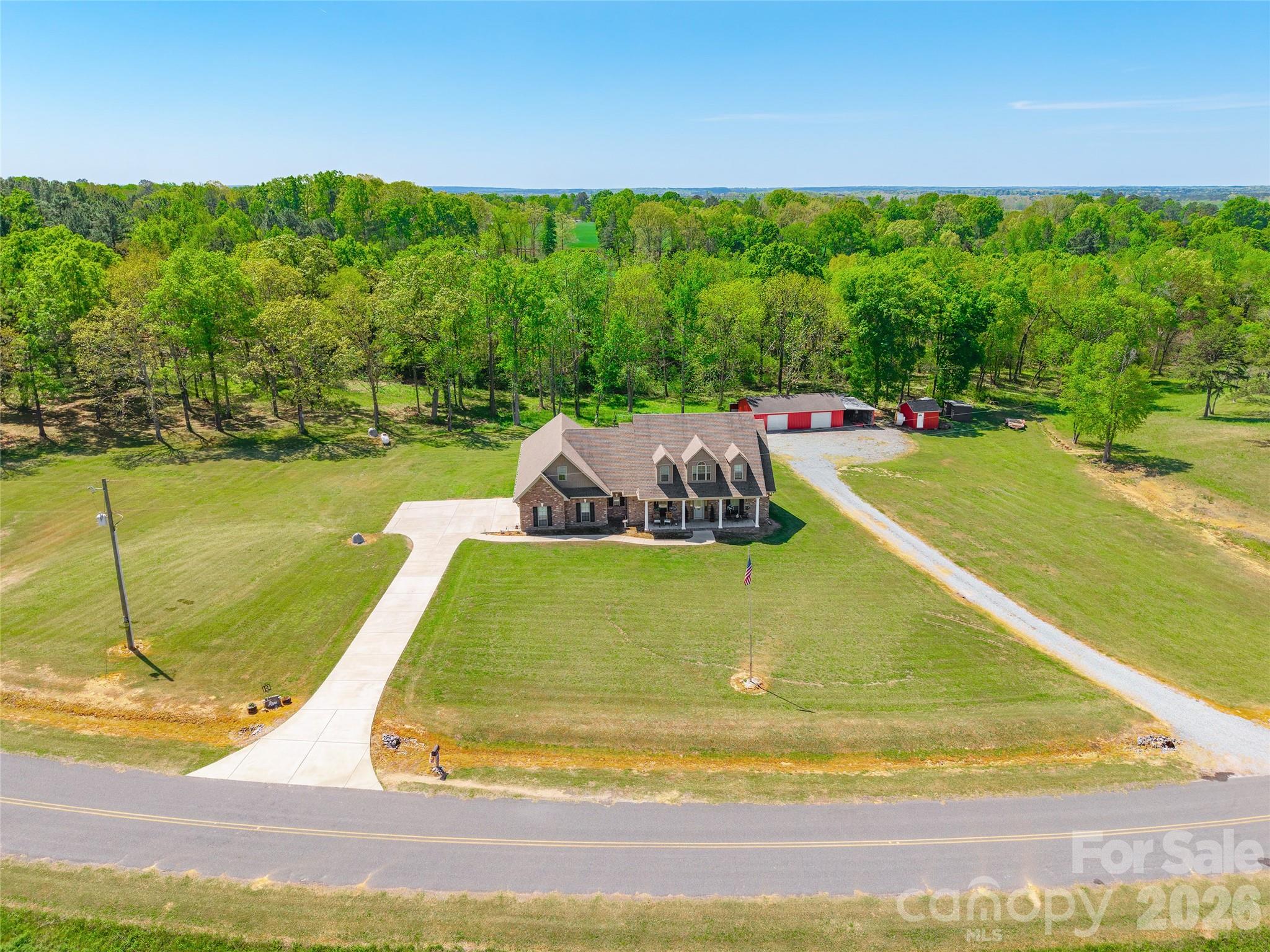 643 John Doster Road Pageland, SC 29728 - Photo 2 of 35 a view of a swimming pool with an outdoor seating and yard