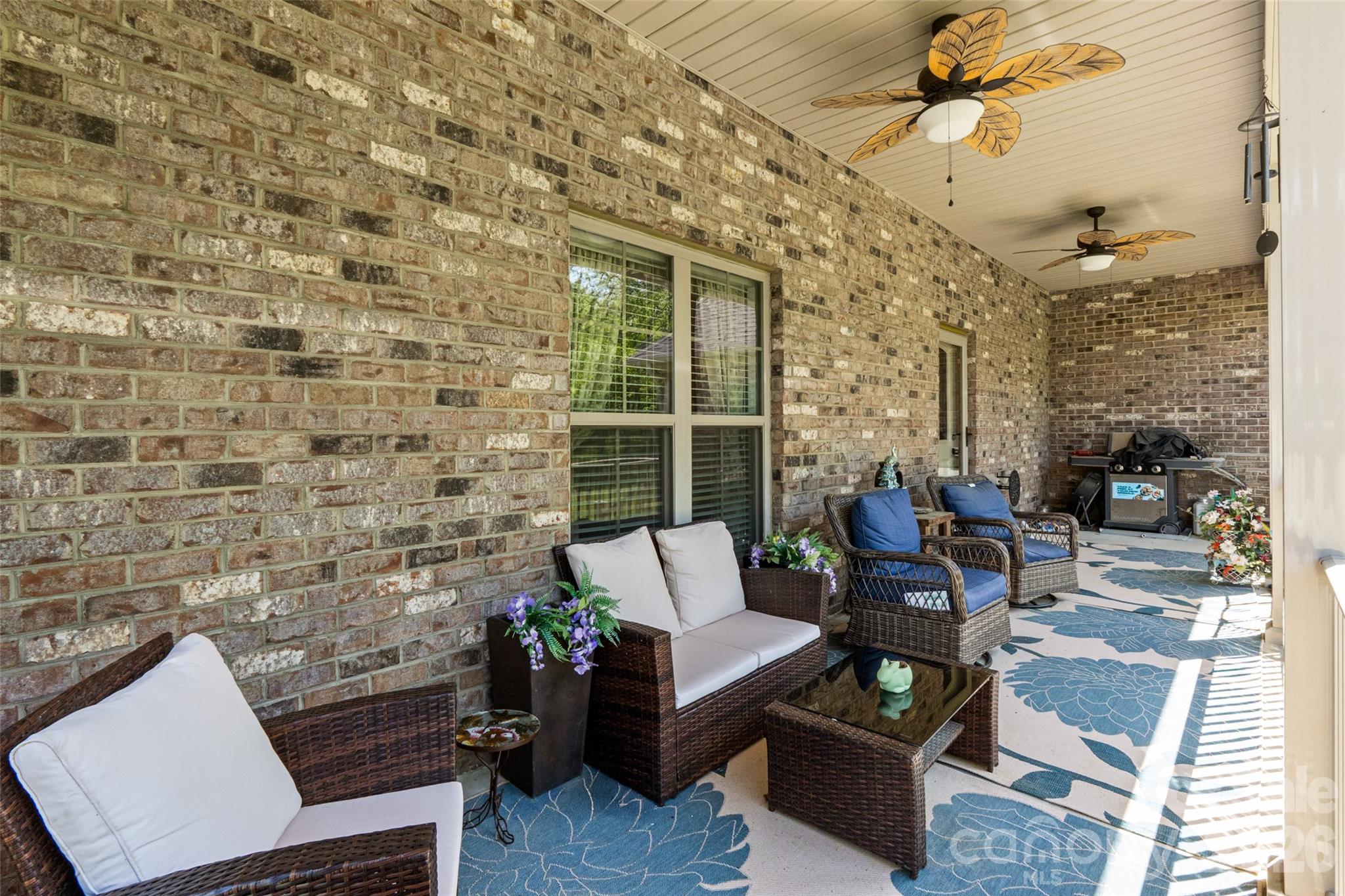 643 John Doster Road Pageland, SC 29728 - Photo 32 of 35 a outdoor living space with furniture and a potted plant