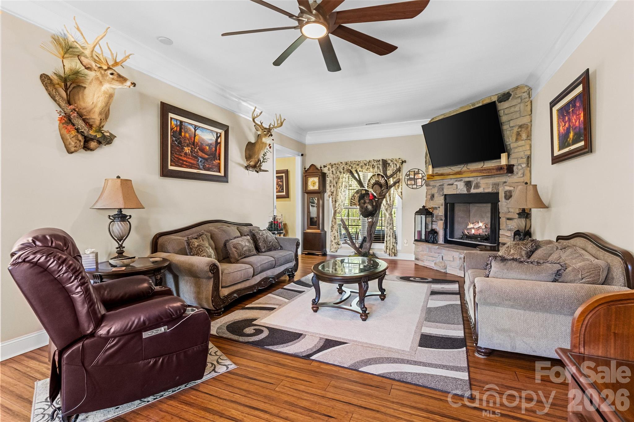 643 John Doster Road Pageland, SC 29728 - Photo 8 of 35 a living room with furniture a flat screen tv and a fireplace
