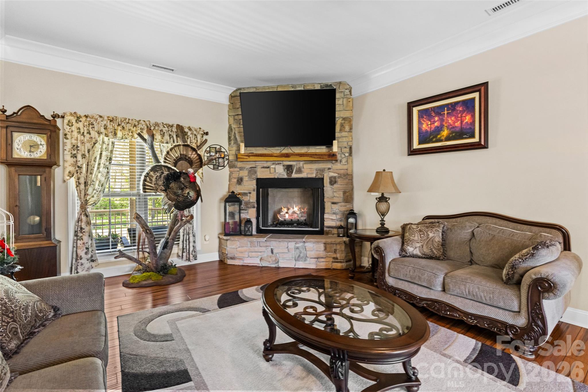 643 John Doster Road Pageland, SC 29728 - Photo 9 of 35 a living room with furniture a flat screen tv and a fireplace