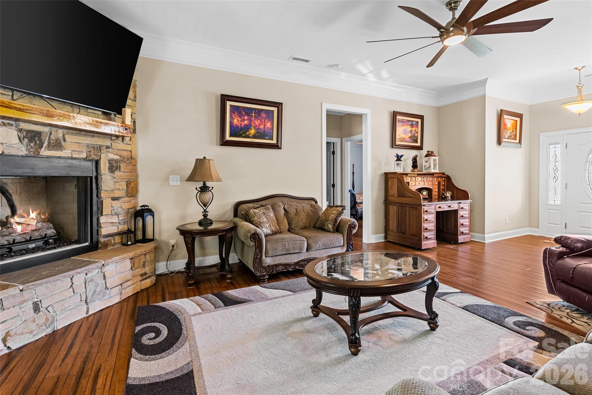 643 John Doster Road Pageland, SC 29728 - Photo 10 of 35 a living room with furniture a flat screen tv and a fireplace