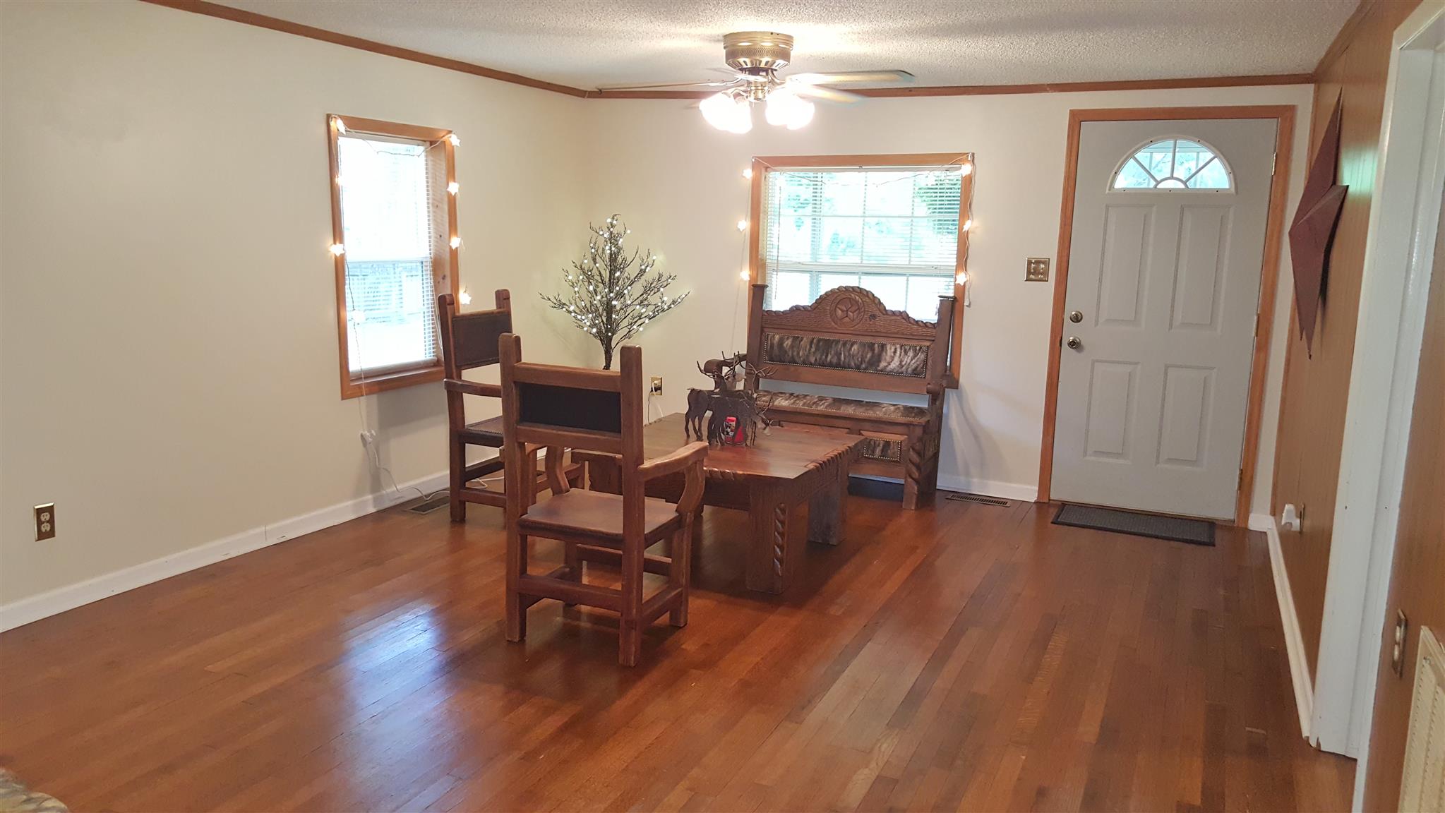 345 Davis Road Camden, TN 38320 - Photo 13 of 30 a dining room with furniture and wooden floor