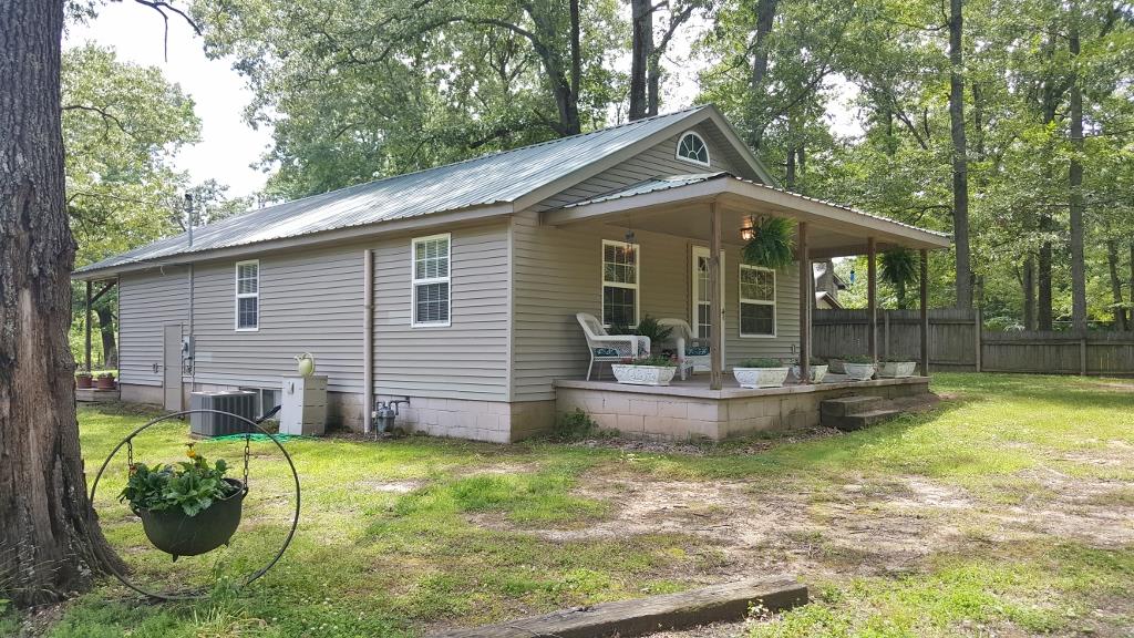 345 Davis Road Camden, TN 38320 - Photo 7 of 30 a view of a house with backyard