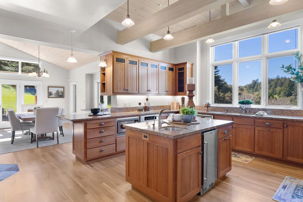 4575 Paul Sweet Road Soquel, CA 95073 - Photo 13 of 55 a kitchen with stainless steel appliances granite countertop a sink a stove and a wooden floors