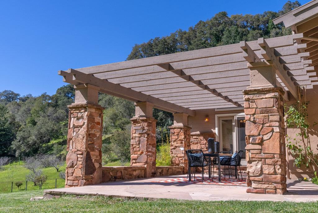 4575 Paul Sweet Road Soquel, CA 95073 - Photo 20 of 55 a view of a patio with table and chairs with wooden floor and fence