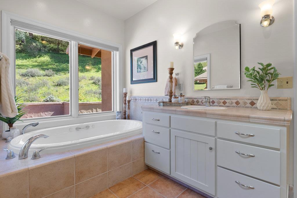 4575 Paul Sweet Road Soquel, CA 95073 - Photo 26 of 55 a spacious bathroom with sinks mirror and a bathtub next to a window