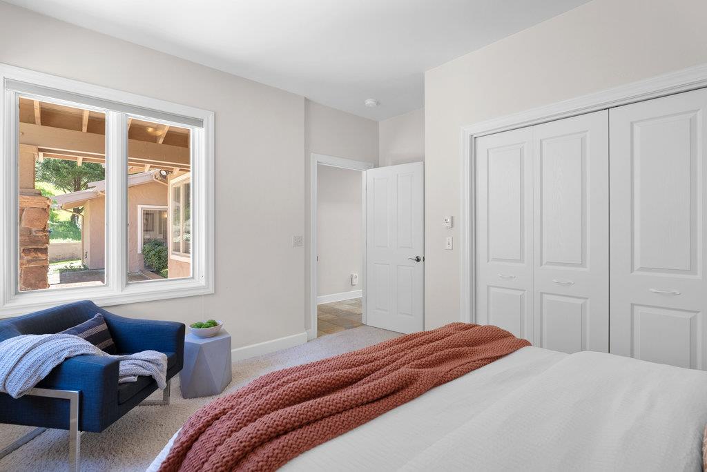 4575 Paul Sweet Road Soquel, CA 95073 - Photo 30 of 55 a bedroom with a bed and a window