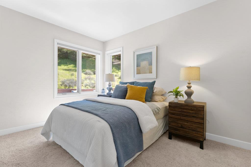 4575 Paul Sweet Road Soquel, CA 95073 - Photo 32 of 55 a bedroom with a bed and a window