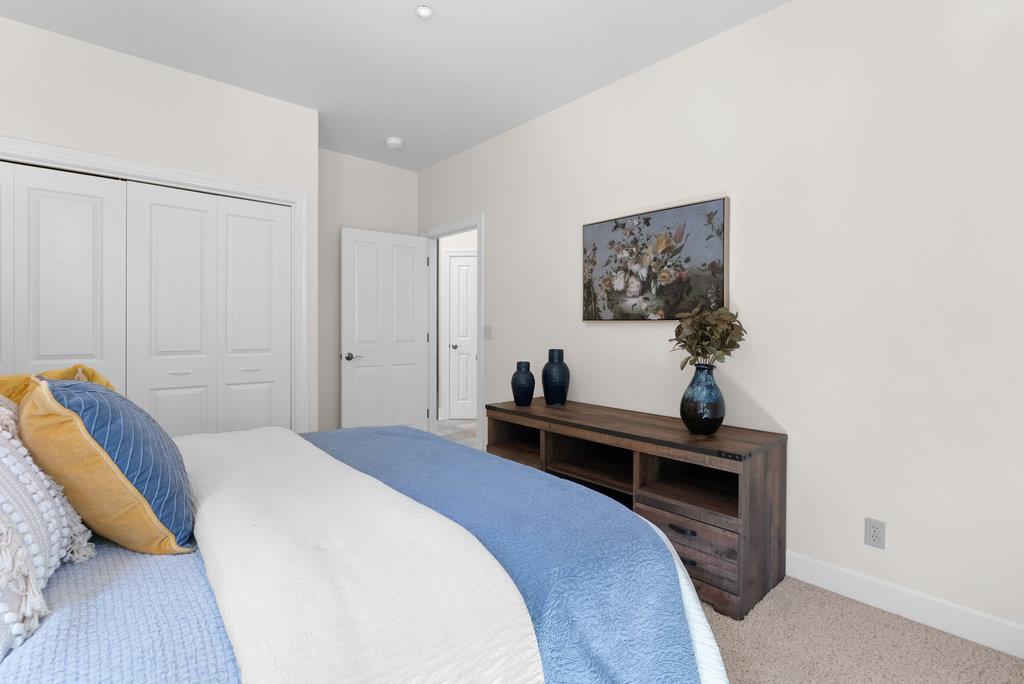 4575 Paul Sweet Road Soquel, CA 95073 - Photo 33 of 55 a bedroom with a bed and a potted plant