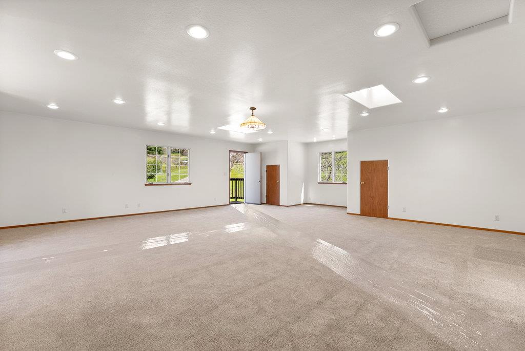 4575 Paul Sweet Road Soquel, CA 95073 - Photo 42 of 55 an empty room with windows and entrance