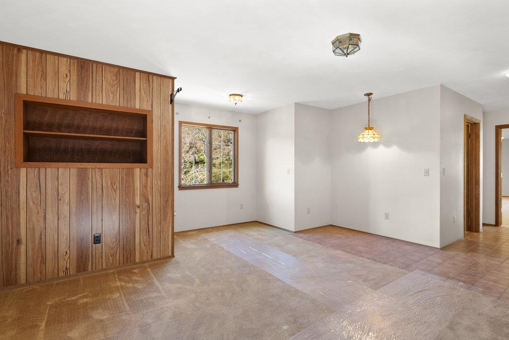 4575 Paul Sweet Road Soquel, CA 95073 - Photo 45 of 55 an empty room with windows and cabinet