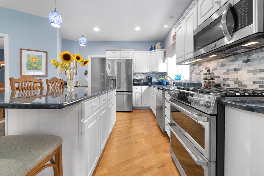140 Wickford Point Road North Kingstown, RI 02852 - Photo 13 of 40 Newer appliances, granite counter, tile backsplash, new light fixtures