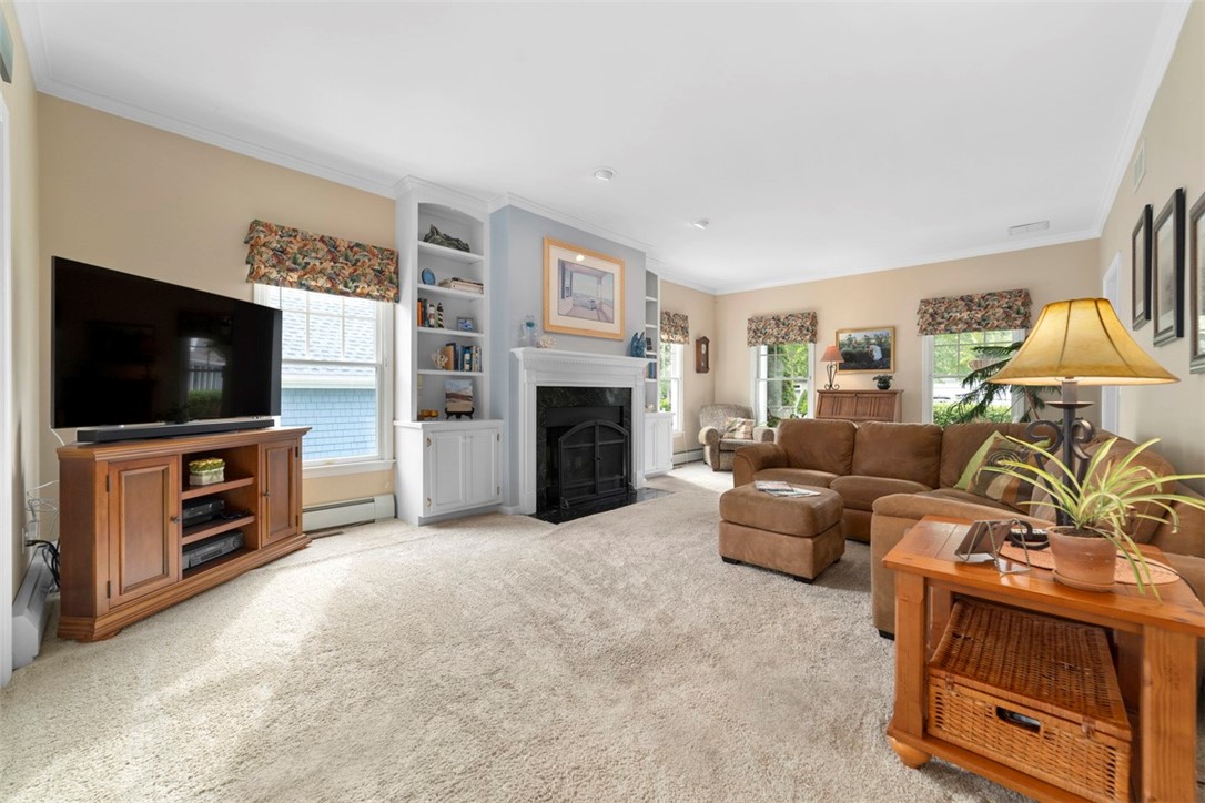 140 Wickford Point Road North Kingstown, RI 02852 - Photo 16 of 40 Wood burning fireplace, built-ins, high ceilings, crown molding