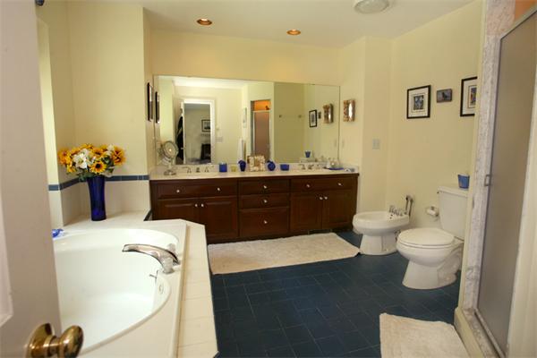 32 Chandler Road Boxford, MA 01921 - Photo 16 of 28 a bathroom with a sink vanity mirror and toilet