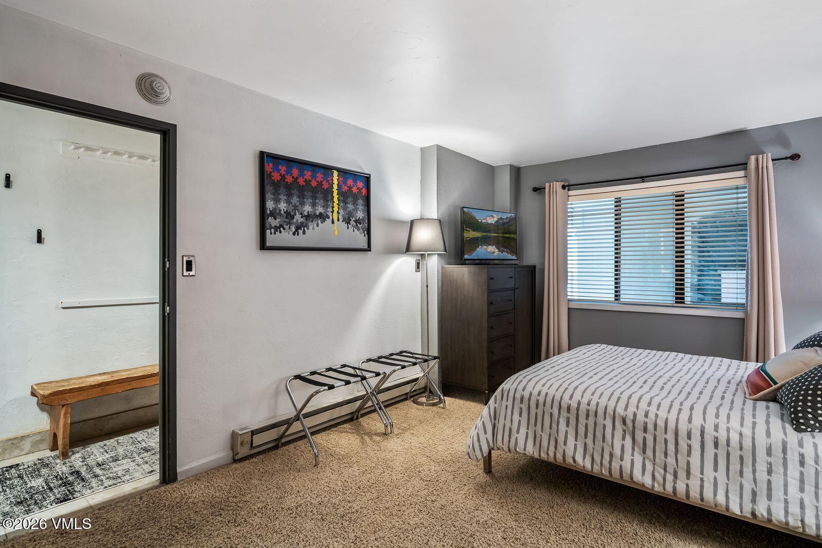 500 South Frontage Road East, Unit 308 Vail, CO 81657 - Photo 13 of 25 a bedroom with a bed and a window