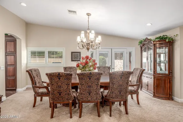 a view of a dining room with furniture and window