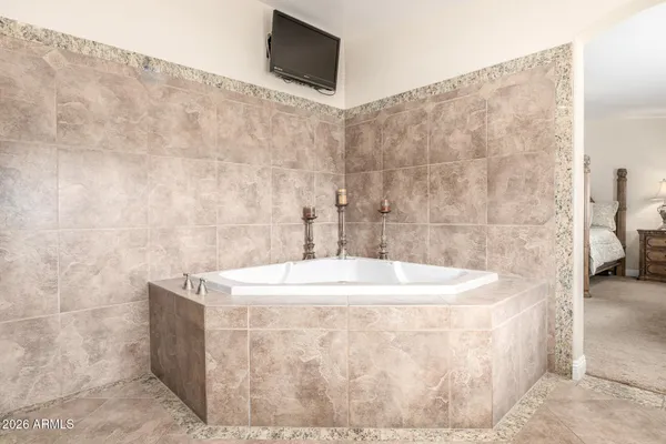a white bath tub sitting in a bathroom