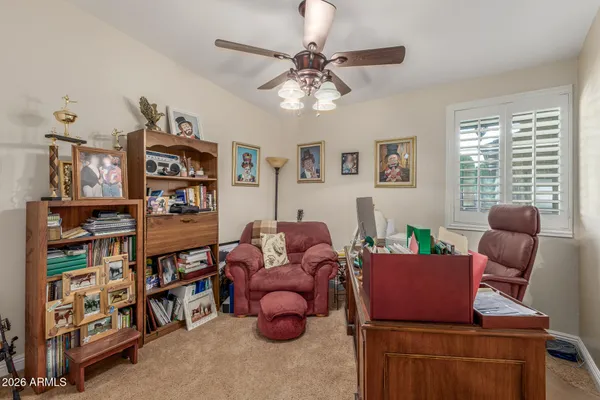 a living room with furniture cabinets and window