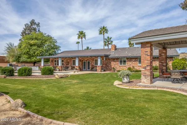 a view of a house with a yard porch and sitting area