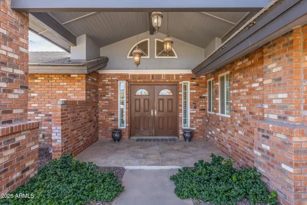 a front view of a building with garden