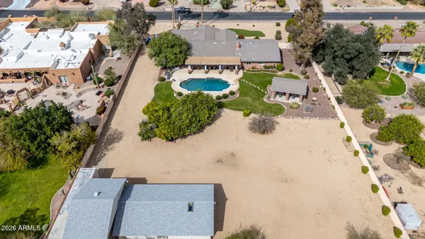 an aerial view of residential houses with outdoor space