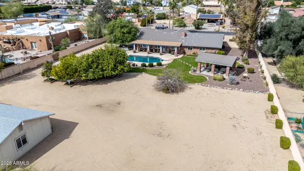 an aerial view of residential house with outdoor space and mountain view