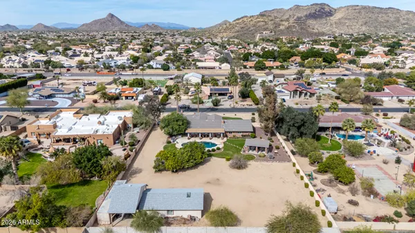 an aerial view of a house with swimming pool