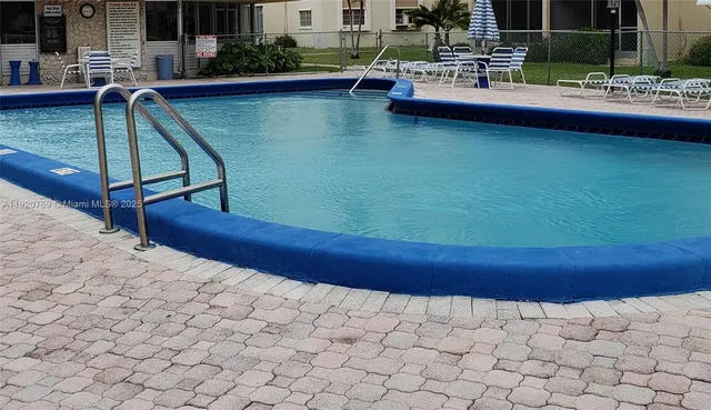 a view of swimming pool from a balcony