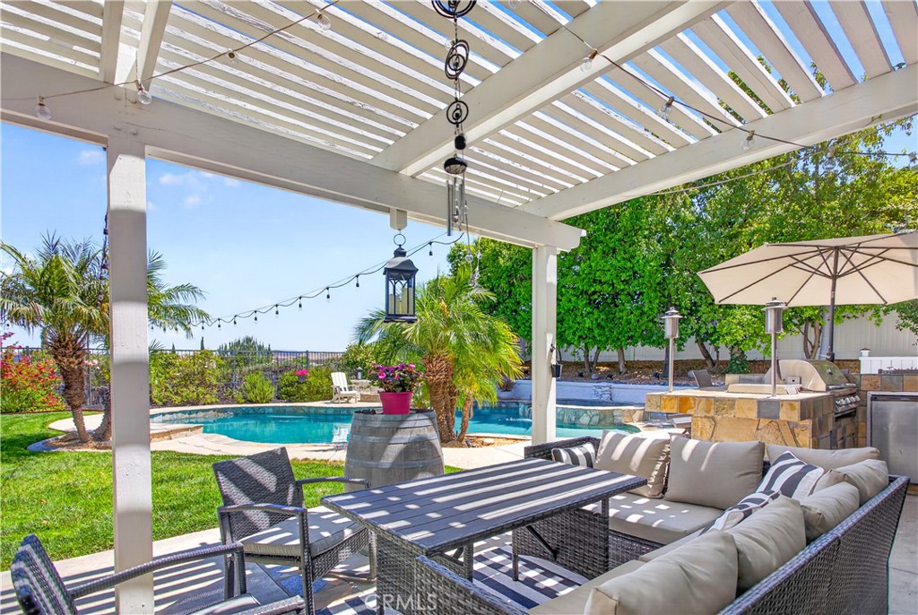 31928 Cercle Chambertin Temecula, CA 92591 - Photo 56 of 74 a view of a patio with couches potted plants and a big yard
