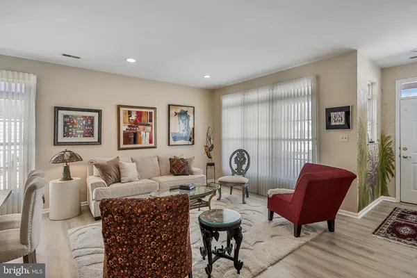 a living room with furniture and a chair