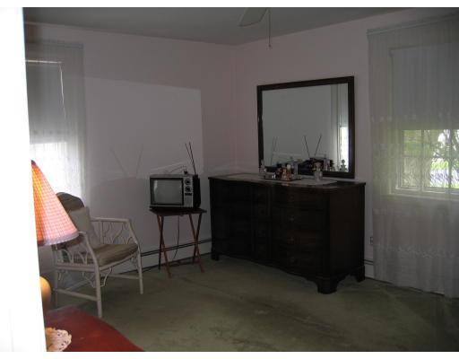 14 Belmont Road Wakefield, MA 01880 - Photo 11 of 15 a living room with furniture and a mirror