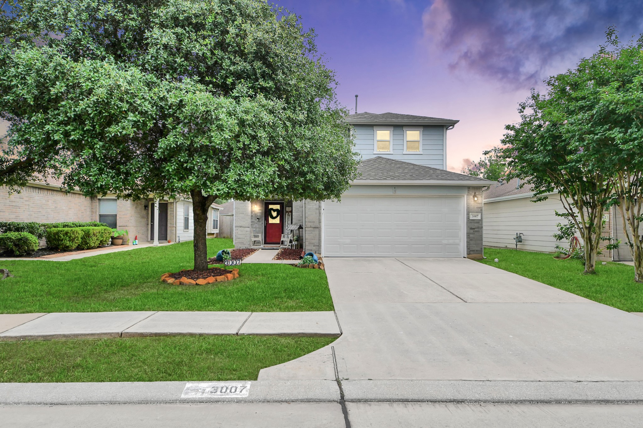 Charming two story 3 bedroom, 2.5 bathroom home with beautiful curb appeal, mature trees, and a welcoming front exterior.