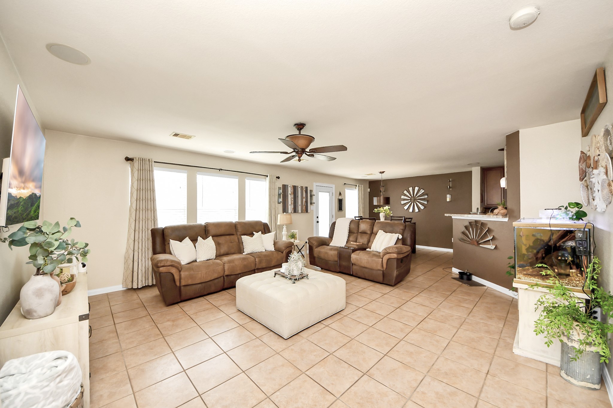 3007 Swift Brook Glen Way Spring, TX 77389 - Photo 11 of 32 Open concept living area with great natural light, spacious seating areas, and a seamless flow into the kitchen and dining spaces perfect for entertaining.