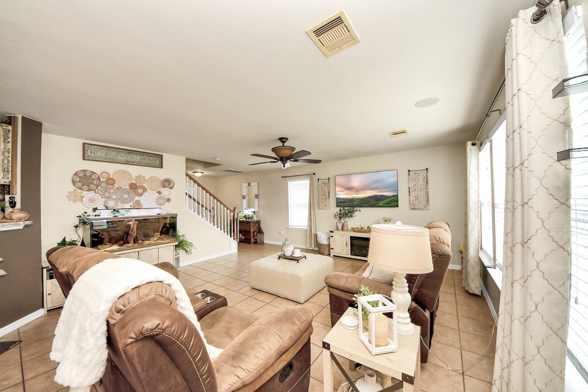 3007 Swift Brook Glen Way Spring, TX 77389 - Photo 3 of 32 Bright and inviting living area with abundant natural light, neutral tones, and an open layout perfect for everyday living and entertaining.