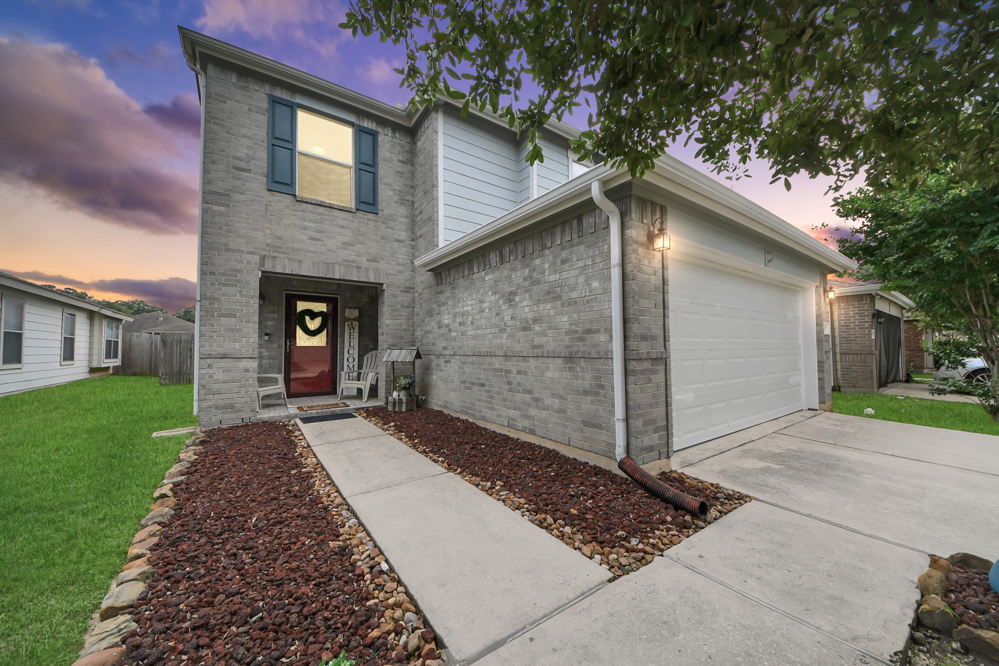 3007 Swift Brook Glen Way Spring, TX 77389 - Photo 7 of 32 Well maintained home with beautiful landscaping, gutters, and a charming front entrance that adds to the inviting curb appeal.