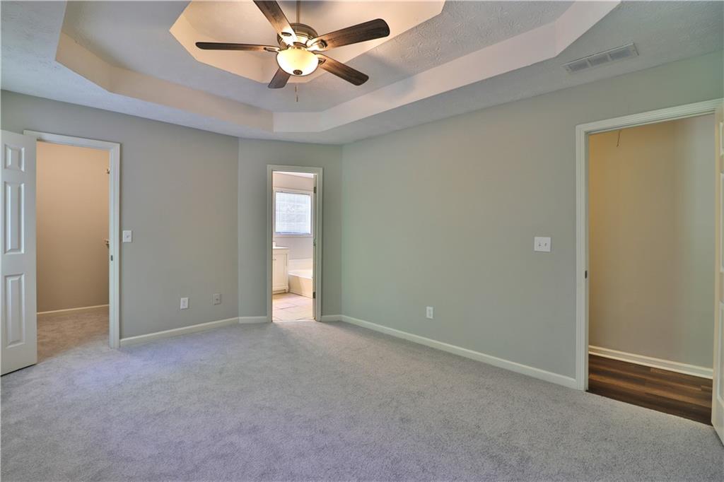 353 Fall View Court Winder, GA 30680 - Photo 36 of 61 an empty room with closet and a chandelier fan