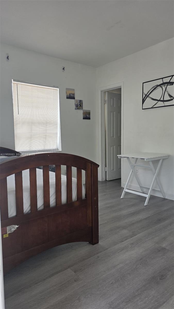 2729 Northwest 47th Street Miami, FL 33142 - Photo 17 of 34 a view of wooden floor and windows in a room