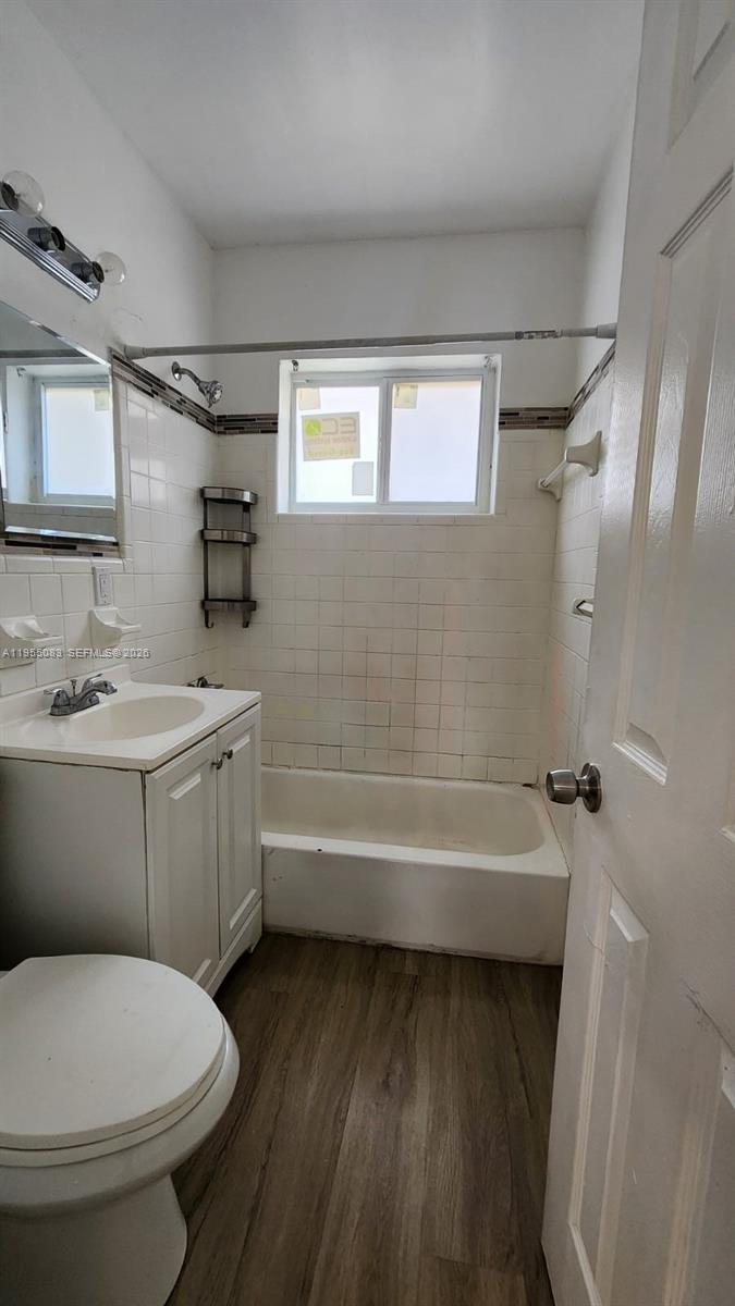 2729 Northwest 47th Street Miami, FL 33142 - Photo 19 of 34 a bathroom with a sink toilet and shower