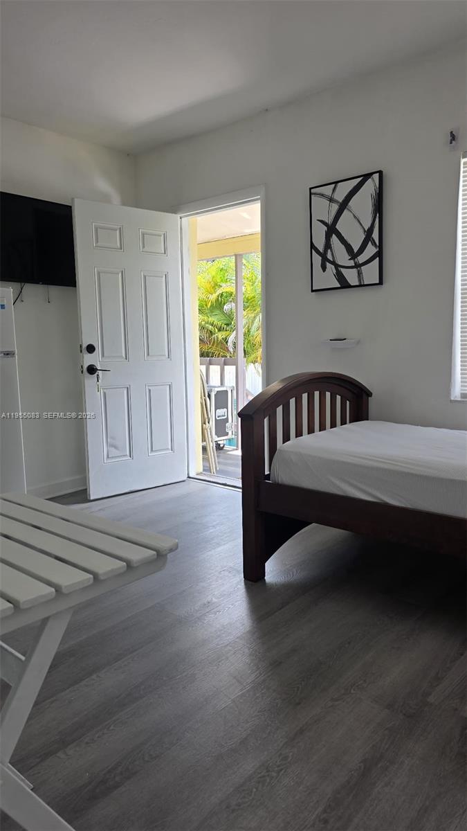 2729 Northwest 47th Street Miami, FL 33142 - Photo 20 of 34 a bedroom with furniture and a window